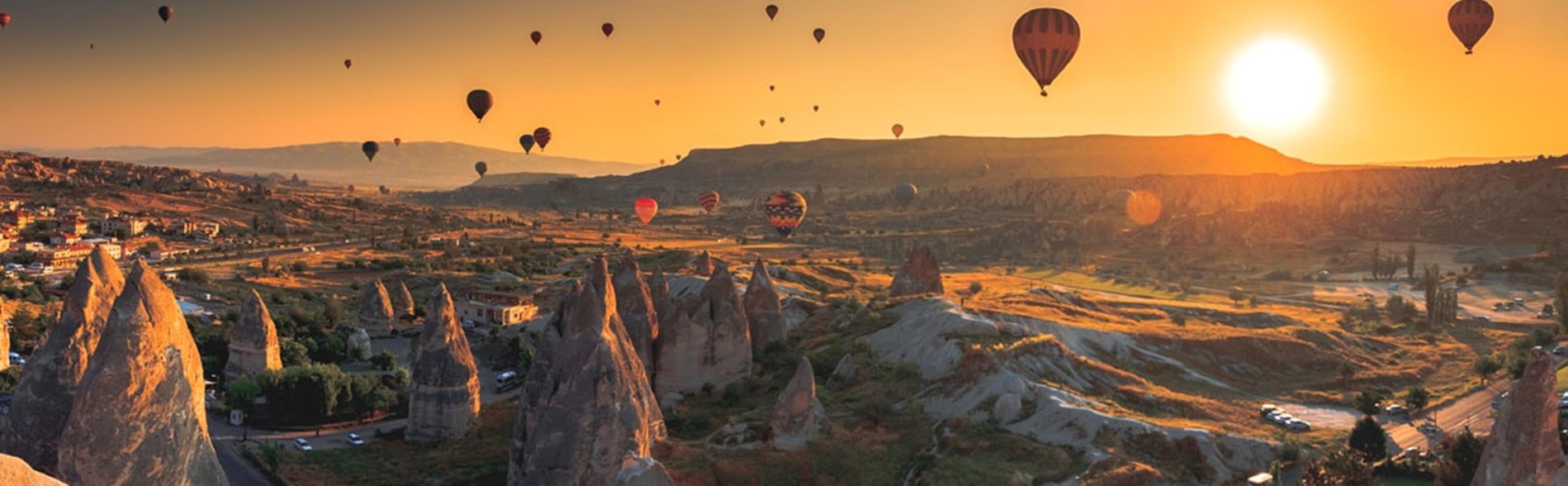 Hot air balloons over Cappadocia at sunrise
